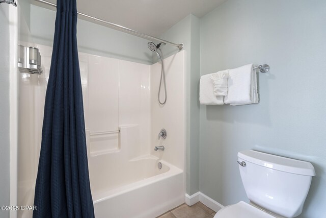 9900 S Thomas Dr Unit 425, Panama City, FL 32408 - full bath with baseboards, shower / tub combo, toilet, and tile patterned flooring