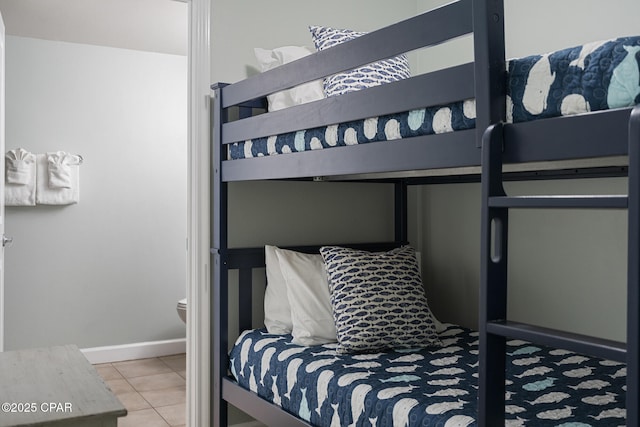9900 S Thomas Dr Unit 425, Panama City, FL 32408 - bedroom featuring tile patterned floors and baseboards