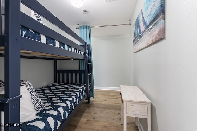 9900 S Thomas Dr Unit 425, Panama City, FL 32408 - bedroom featuring wood finished floors