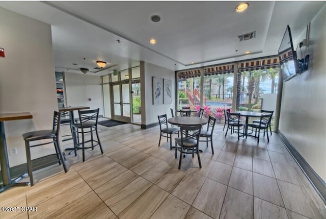 9900 S Thomas Dr Unit 425, Panama City, FL 32408 - dining room featuring baseboards, visible vents, and recessed lighting