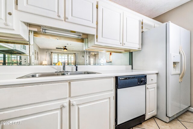 17462 Front Beach Rd Unit 56206, Panama City Beach, FL 32413 - kitchen with white appliances, light countertops, ceiling fan, a sink, and white cabinetry