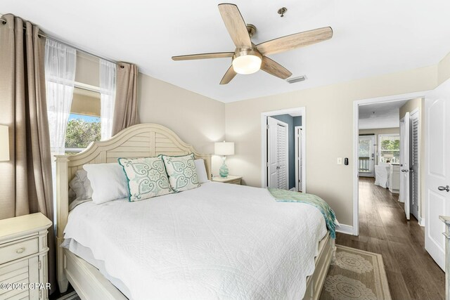 17690 Front Beach Rd Unit D307, Panama City Beach, FL 32413 - bedroom featuring baseboards, a ceiling fan, and dark wood-style flooring