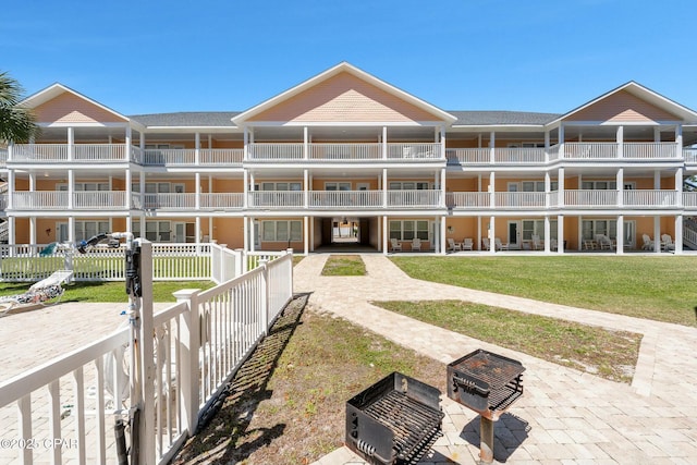 17690 Front Beach Rd Unit D307, Panama City Beach, FL 32413 - view of building exterior with fence