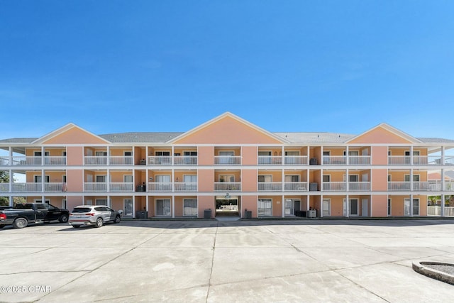 17690 Front Beach Rd Unit D307, Panama City Beach, FL 32413 - view of building exterior with uncovered parking