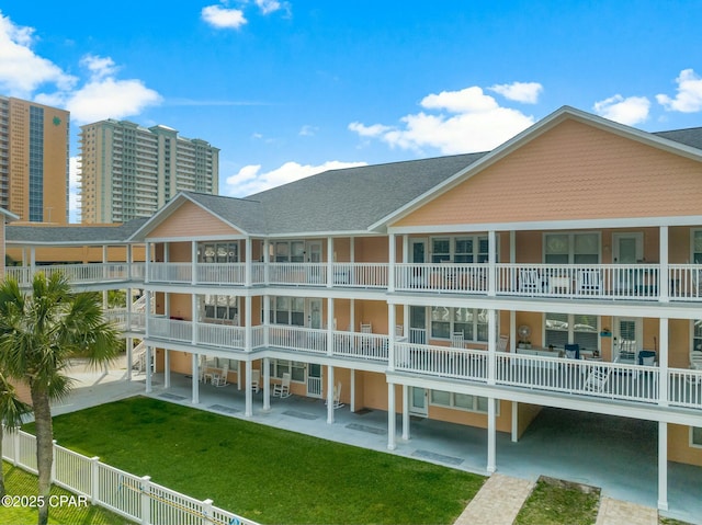 17690 Front Beach Rd Unit D307, Panama City Beach, FL 32413 - view of building exterior with fence