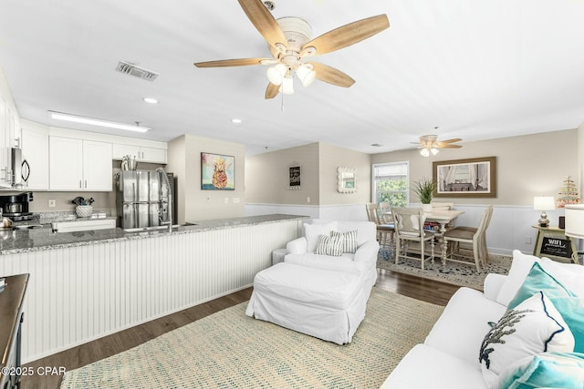 17690 Front Beach Rd Unit D307, Panama City Beach, FL 32413 - living area with visible vents, recessed lighting, wainscoting, wood finished floors, and a ceiling fan