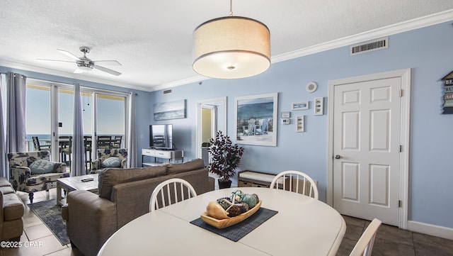 10519 Front Beach Rd Unit 1904B, Panama City Beach, FL 32407 - tiled dining area with ceiling fan, crown molding, a textured ceiling, and visible vents