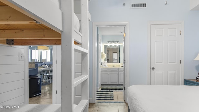 10519 Front Beach Rd Unit 1904B, Panama City Beach, FL 32407 - bedroom with ensuite bath, light tile patterned flooring, and visible vents