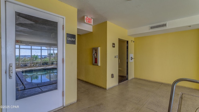 10519 Front Beach Rd Unit 1904B, Panama City Beach, FL 32407 - hall with speckled floor and visible vents