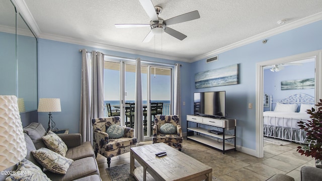 10519 Front Beach Rd Unit 1904B, Panama City Beach, FL 32407 - living area featuring a ceiling fan, crown molding, a textured ceiling, baseboards, and visible vents