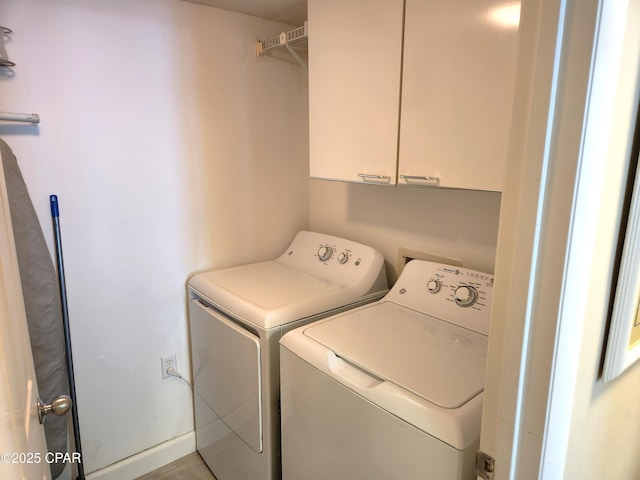 7205 Thomas Dr Unit E706, Panama City, FL 32408 - clothes washing area featuring independent washer and dryer and cabinet space