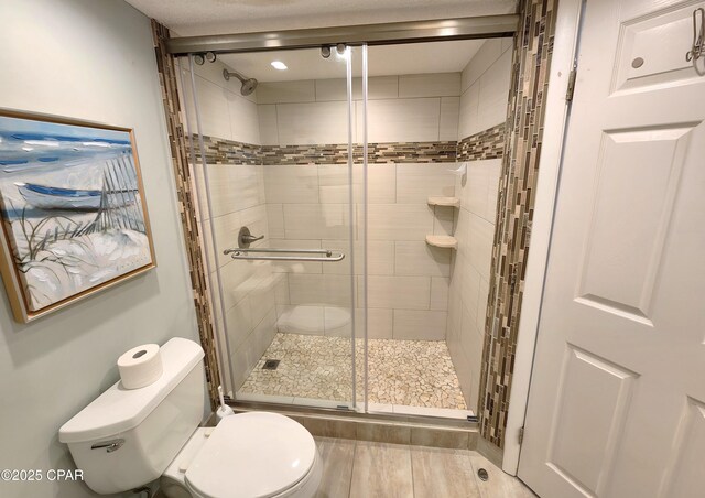 7205 Thomas Dr Unit E706, Panama City, FL 32408 - bathroom with toilet and a shower stall