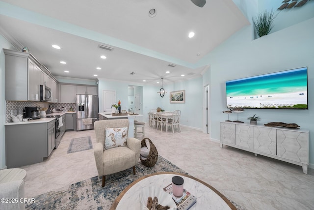 living area featuring visible vents, vaulted ceiling, baseboards, ornamental molding, and recessed lighting