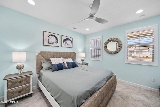 bedroom with baseboards, recessed lighting, a ceiling fan, and multiple windows