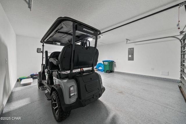 garage featuring baseboards and electric panel