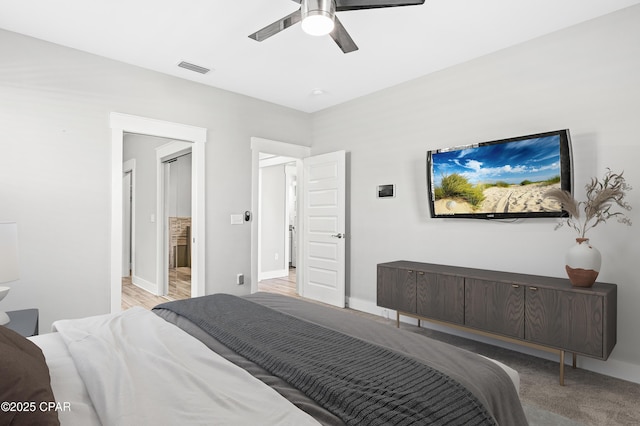 bedroom featuring baseboards, visible vents, and a ceiling fan
