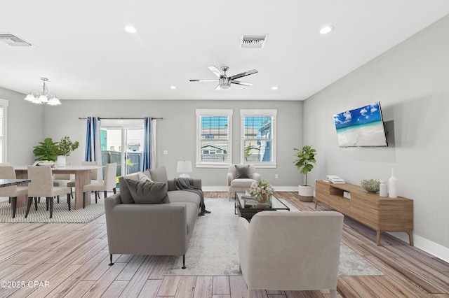 living area featuring visible vents, recessed lighting, and light wood-type flooring