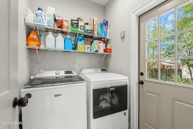 laundry room with separate washer and dryer and laundry area