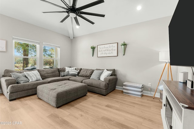 living area featuring vaulted ceiling, recessed lighting, light wood-type flooring, baseboards, and a ceiling fan
