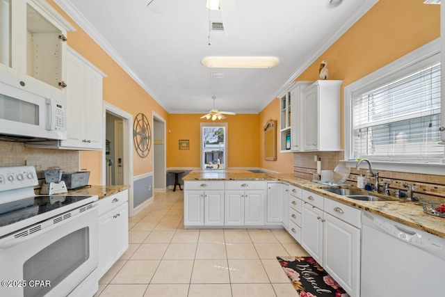 14205 Millcole Ave, Panama City Beach, FL 32413 - kitchen featuring a ceiling fan, a sink, white appliances, a peninsula, and tasteful backsplash