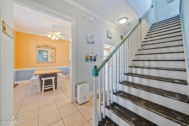 14205 Millcole Ave, Panama City Beach, FL 32413 - staircase featuring a ceiling fan, baseboards, tile patterned flooring, and crown molding