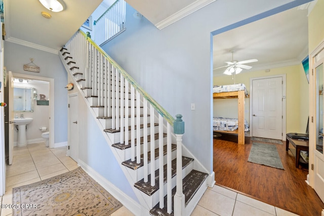 14205 Millcole Ave, Panama City Beach, FL 32413 - staircase featuring ceiling fan, tile patterned flooring, baseboards, and ornamental molding