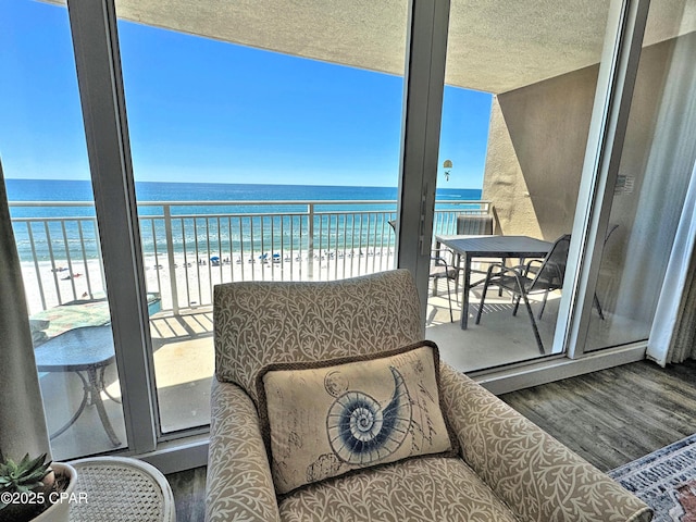 balcony with a view of the beach and a water view