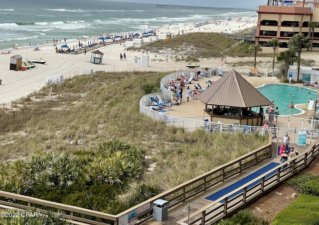 birds eye view of property with a view of the beach and a water view
