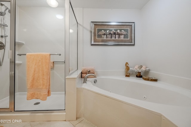 full bath featuring a shower stall, a whirlpool tub, and tile patterned flooring