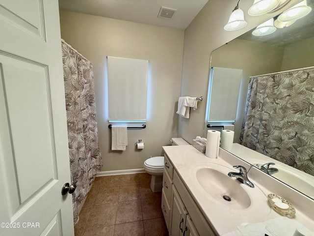 2557 Woods View Dr, Marianna, FL 32446 - bathroom featuring tile patterned floors, toilet, vanity, baseboards, and visible vents