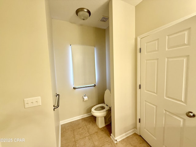 2557 Woods View Dr, Marianna, FL 32446 - bathroom featuring tile patterned flooring, toilet, baseboards, and visible vents
