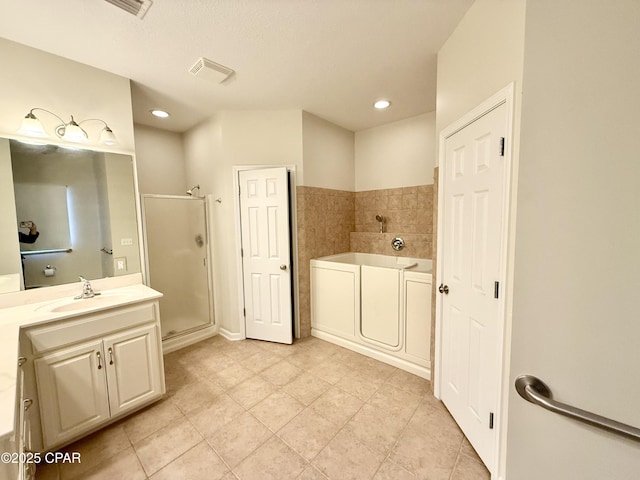 2557 Woods View Dr, Marianna, FL 32446 - bathroom with a bath, visible vents, recessed lighting, vanity, and a stall shower
