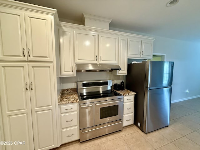 2557 Woods View Dr, Marianna, FL 32446 - kitchen with light tile patterned flooring, baseboards, appliances with stainless steel finishes, under cabinet range hood, and light stone counters