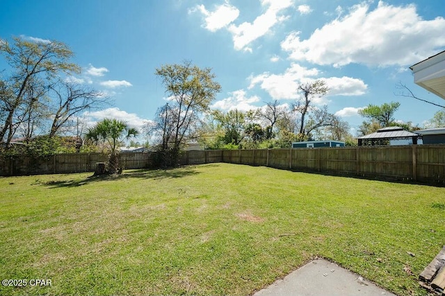view of yard featuring a fenced backyard