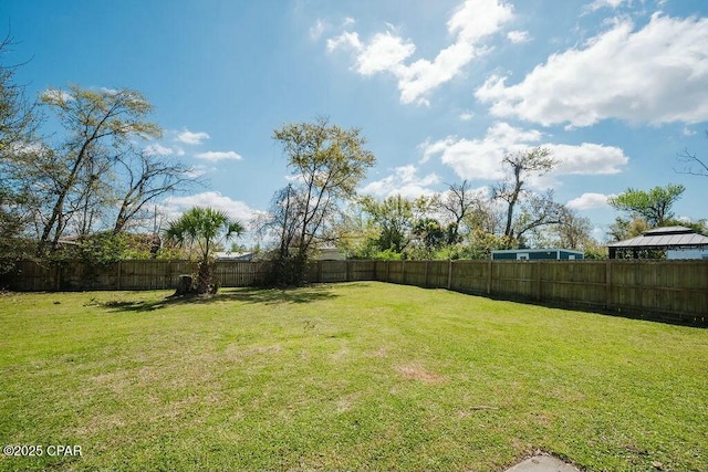 view of yard with a fenced backyard