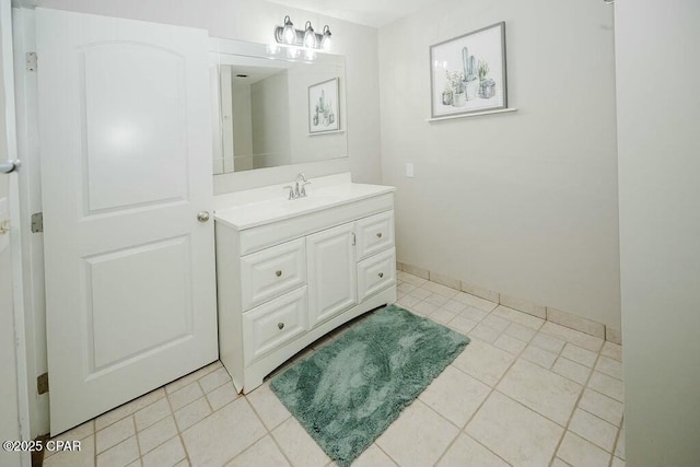 bathroom with tile patterned flooring and vanity