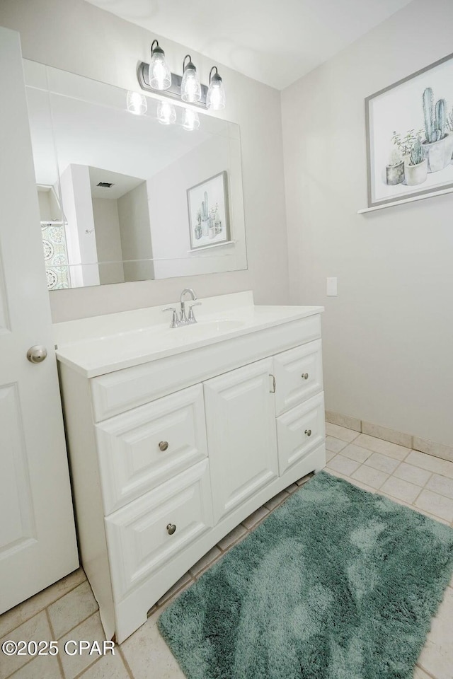bathroom featuring vanity and tile patterned flooring