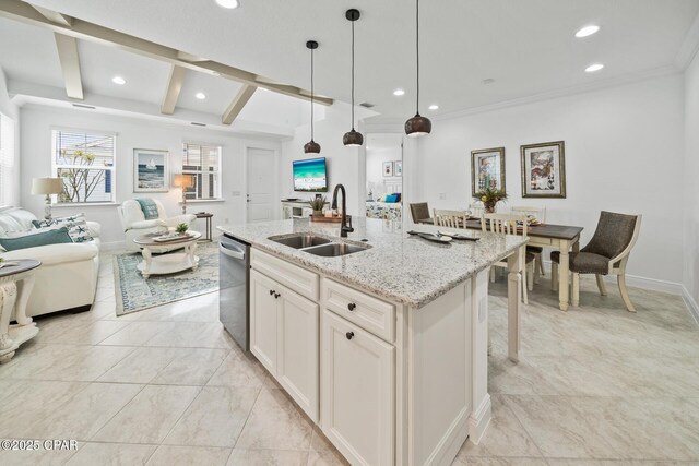 kitchen with a sink, light stone countertops, stainless steel dishwasher, open floor plan, and recessed lighting