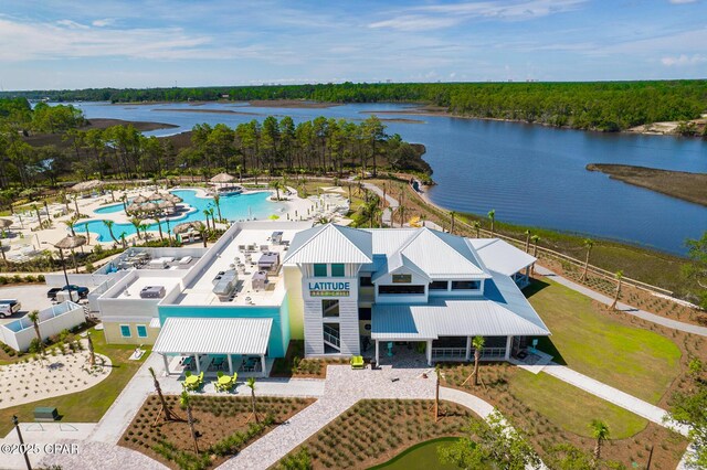 birds eye view of property with a water view