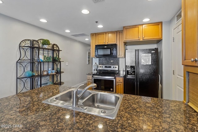 16701 Front Beach Rd Unit 1803, Panama City Beach, FL 32413 - kitchen featuring black appliances, a sink, dark countertops, backsplash, and recessed lighting