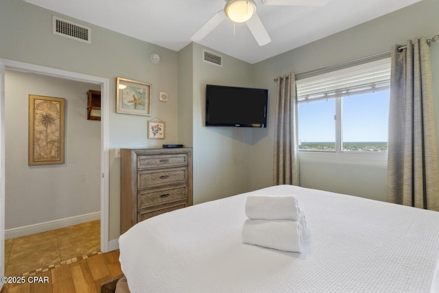 16701 Front Beach Rd Unit 1803, Panama City Beach, FL 32413 - bedroom featuring light wood-style floors, a ceiling fan, and baseboards