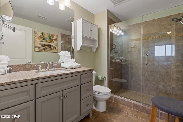 16701 Front Beach Rd Unit 1803, Panama City Beach, FL 32413 - bathroom with a stall shower, vanity, toilet, and tile patterned flooring