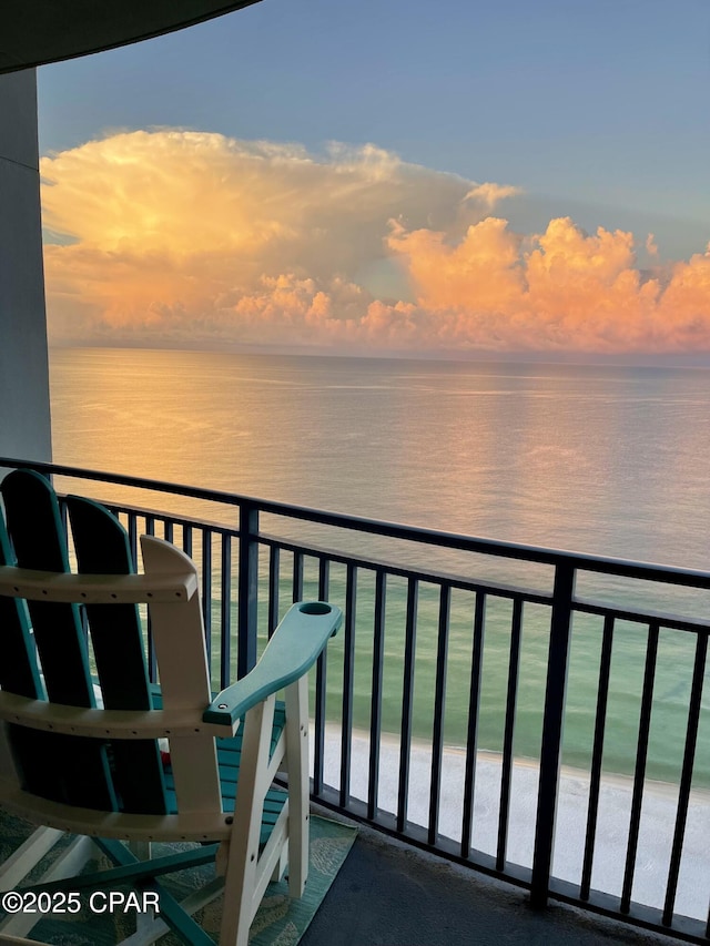 16701 Front Beach Rd Unit 1803, Panama City Beach, FL 32413 - balcony at dusk featuring a water view