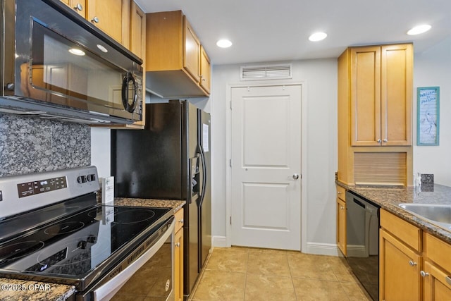 16701 Front Beach Rd Unit 1803, Panama City Beach, FL 32413 - kitchen with black appliances, baseboards, light tile patterned flooring, dark stone countertops, and recessed lighting