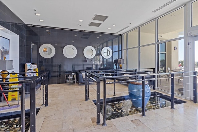 16701 Front Beach Rd Unit 1803, Panama City Beach, FL 32413 - recreation room with recessed lighting, stone tile floors, and floor to ceiling windows