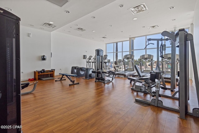 16701 Front Beach Rd Unit 1803, Panama City Beach, FL 32413 - exercise room featuring wood finished floors, expansive windows, and recessed lighting