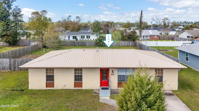 810 Virginia Ave, Lynn Haven, FL 32444 - view of front of home with brick siding, a metal roof, and a residential view