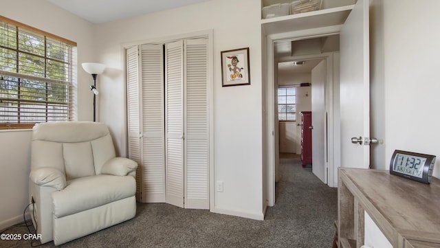 810 Virginia Ave, Lynn Haven, FL 32444 - sitting room featuring dark colored carpet and baseboards