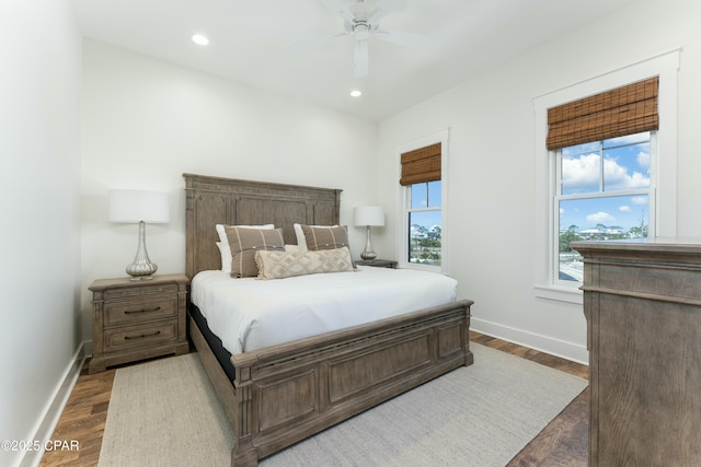 bedroom with baseboards, recessed lighting, and wood finished floors