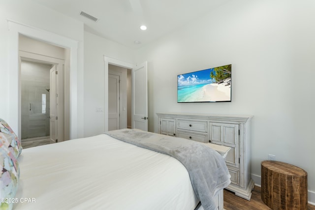 bedroom with dark wood-style floors, recessed lighting, visible vents, and baseboards
